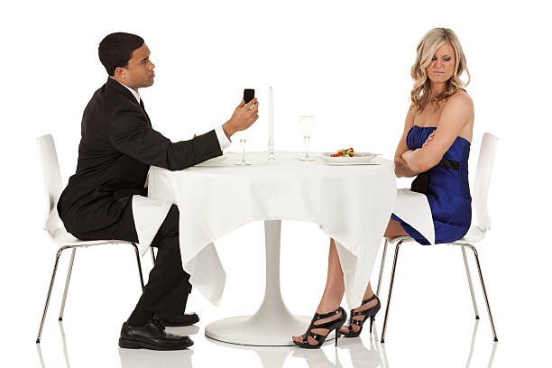 istock Woman ignoring boyfriend's proposal 180726977