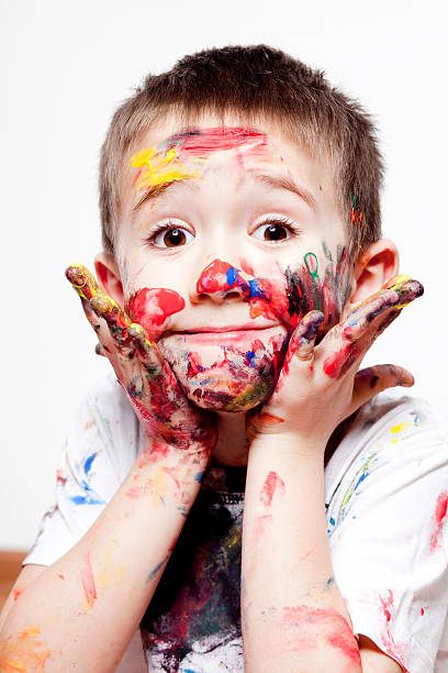 istock Boy having fun with finger paint XXXL 180727255