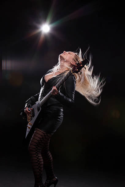 istock Young Woman Playing Guitar 180727496