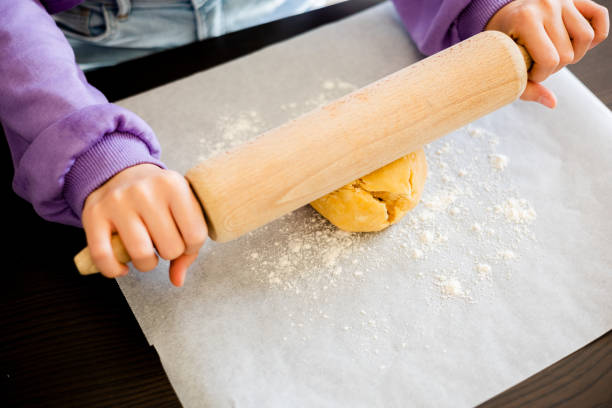istock Kid's Hands Rolling Shortcrust Dough Up Close 1807280585