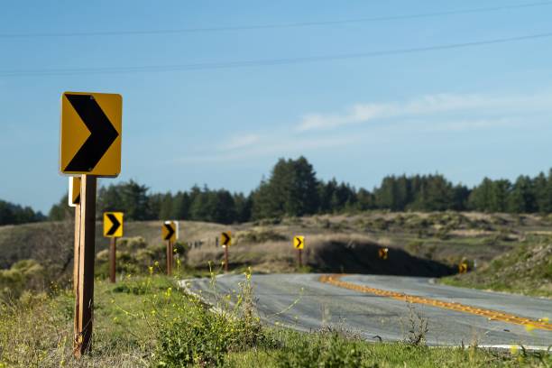 istock Scenic mountain road with directional arrows pointing right. 1807281129