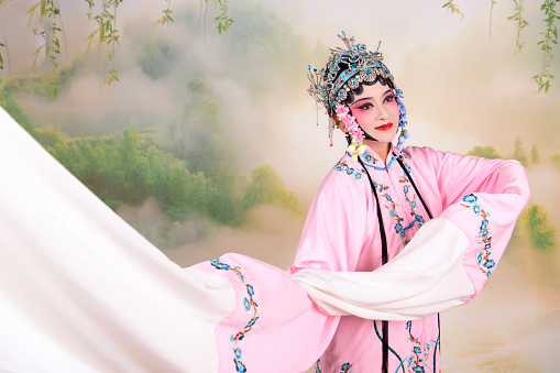 A  Chinese woman performing Beijing Opera on stage