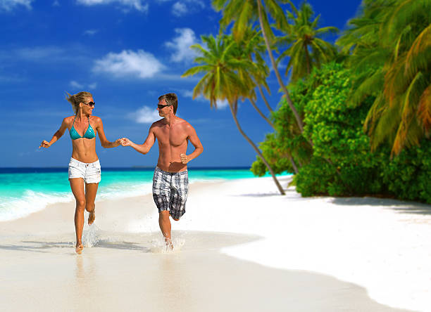 istock Running couple on the beach 180730261