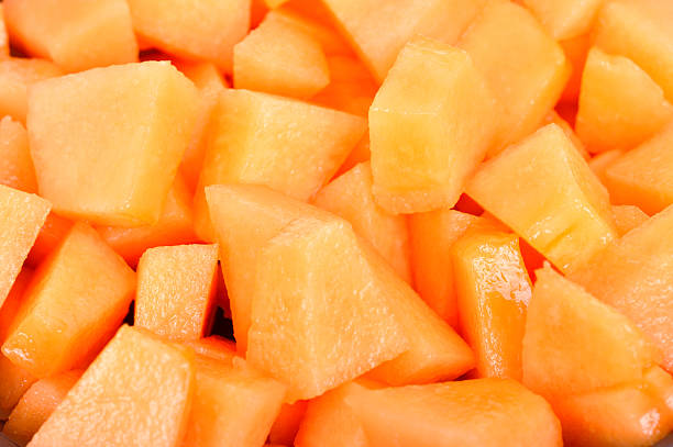 melon cut into slices melon cut into slices melon stock pictures, royalty-free photos & images