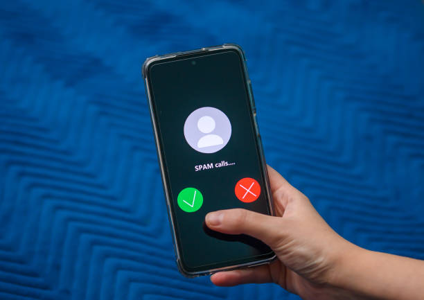 istock Incoming spam call on mobile phone close up 1807307119