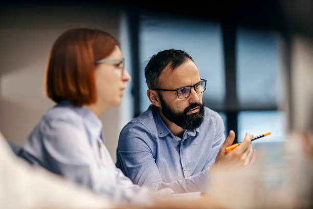 istock An architect is discussing and looking at project with colleague. 1807310856