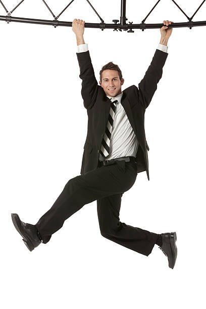 istock Businessman hanging with a metal structure 180731153