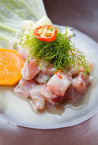 Peruvian ceviche topped with seaweed Raw fish served in lime juice with sweet potato seviche photos stock pictures, royalty-free photos & images
