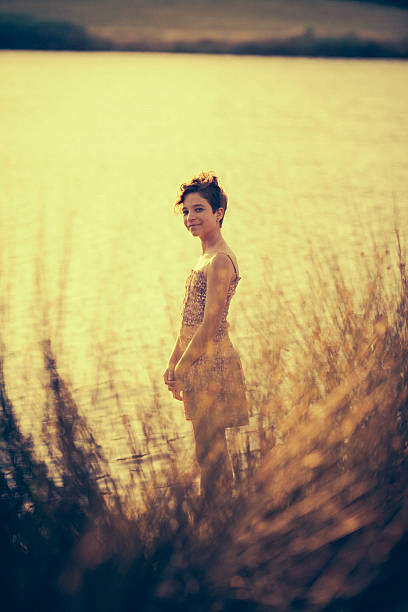 istock Little girl near lake posing 180731444