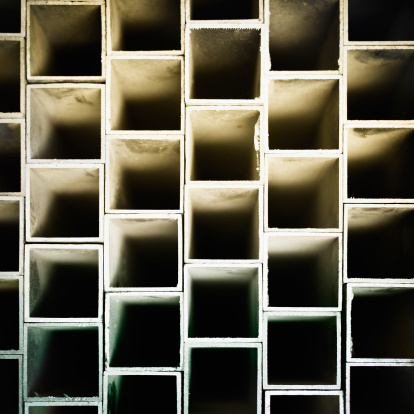 Abstract background created with squere metal pipes. Shallow DOF.
