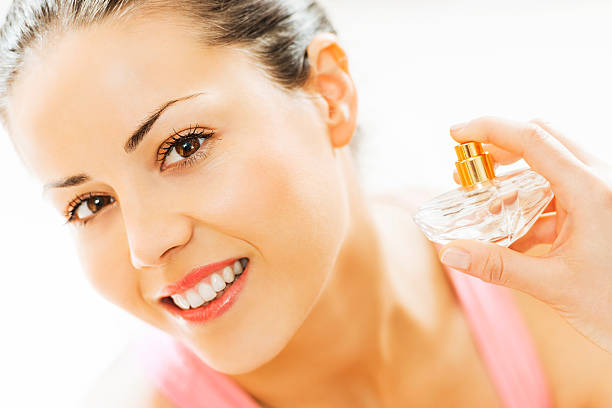 istock Woman putting on perfume. 180731880