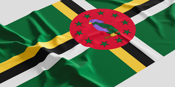 Flag of Dominica. Fabric textured Dominica flag isolated on white background. 3D illustration