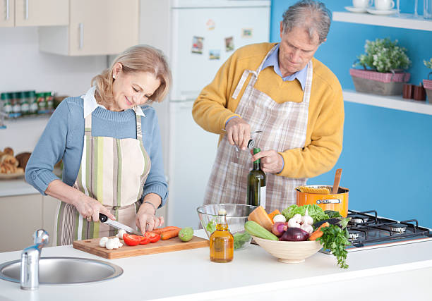 istock Senior couple cooking 180734079