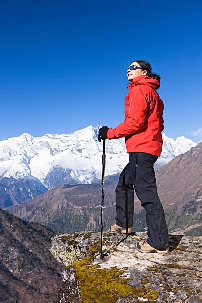 istock Woman trekking  in Himalayas, Nepal 180734877