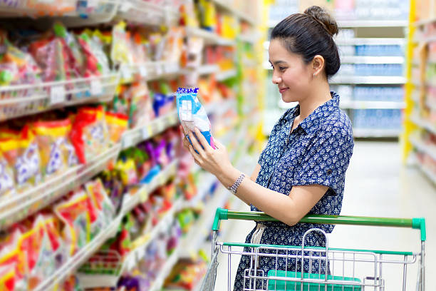 istock Asian woman buys sweets 180735154
