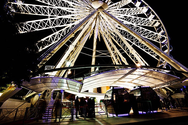 istock Illuminated Ferris Wheel waiting for passengers at night 180735168