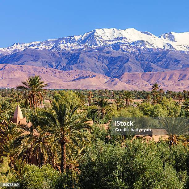 Moroccan Oasis And High Atlas Mouintain Range Stock Photo - Download Image Now - Atlas Mountains, Morocco, Snow