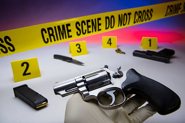 istock Crime scene do not cross, with pistol 180735176