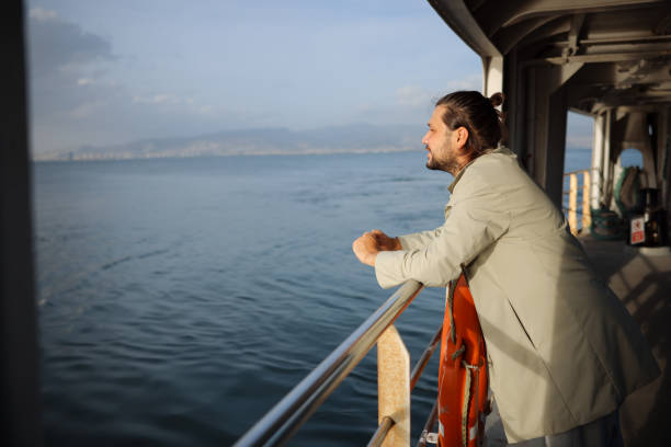 istock Man traveling on ferry through Bosphorus in Izmir 1807357019