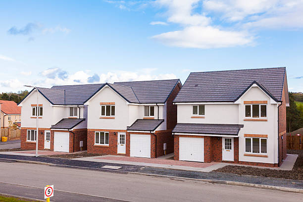 Row of new detached houses. stock photo