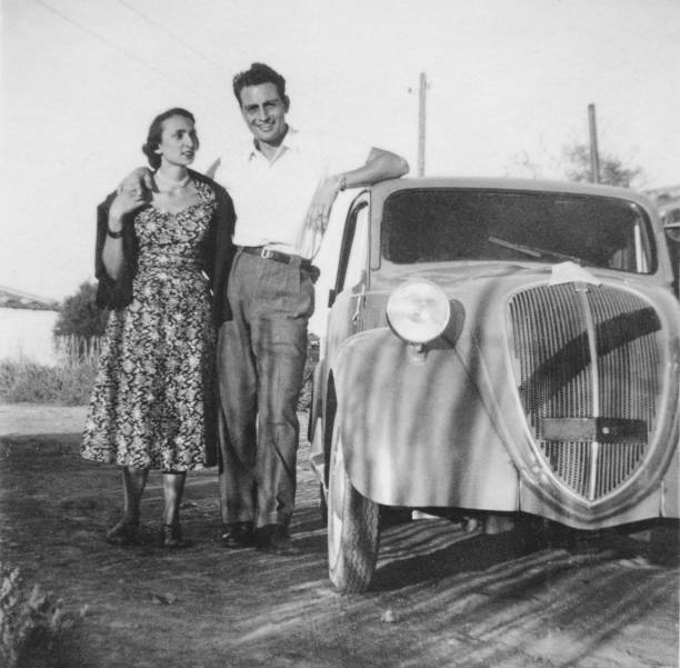 istock Young couple and vintage car. 1807363599
