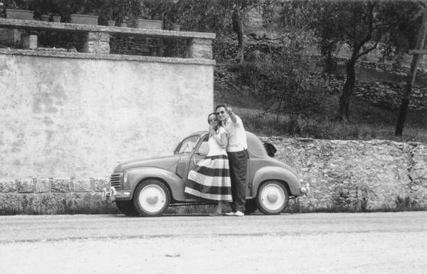 Young couple and vintage car.