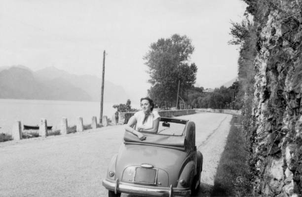 istock Young woman and vintage car. 1807363613