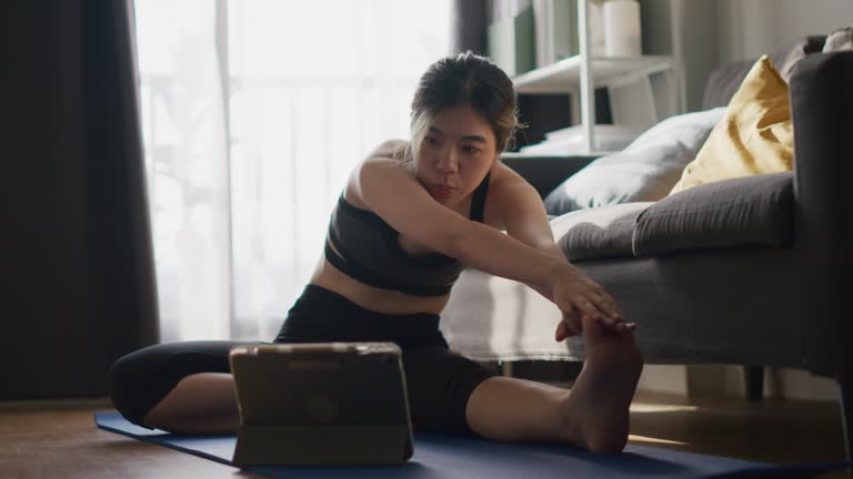 Single asian woman Yoga Stretching Exercises at home