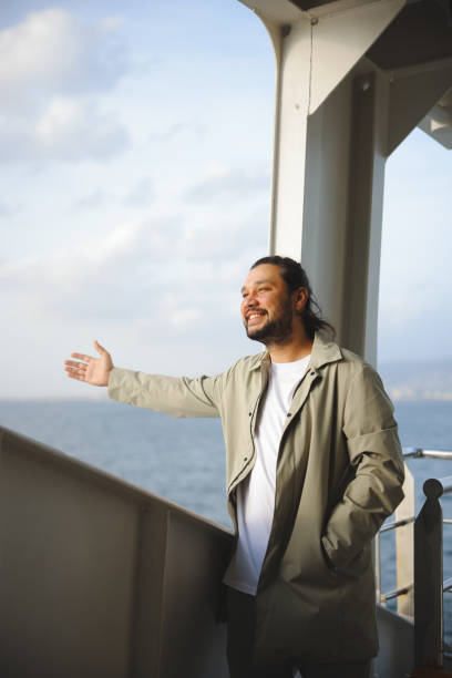 istock Man traveling on ferry through Bosphorus in Izmir 1807366840