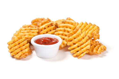 Waffle potato fries with ketchup.
