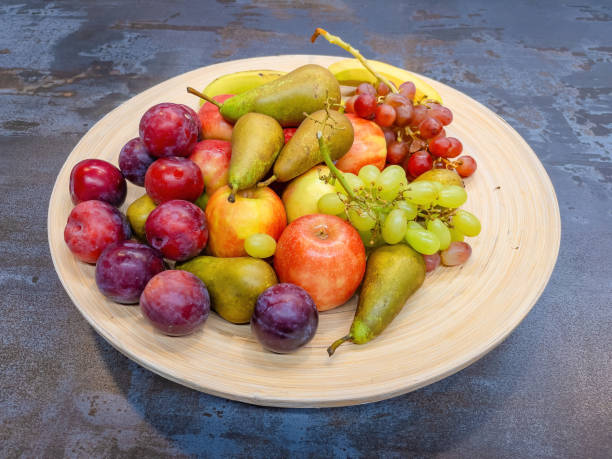 istock fruits plate with fresh grapes, pears, apples 1807370560