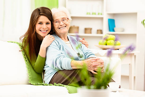 istock Granddaughter hugging her grandmother 180737358