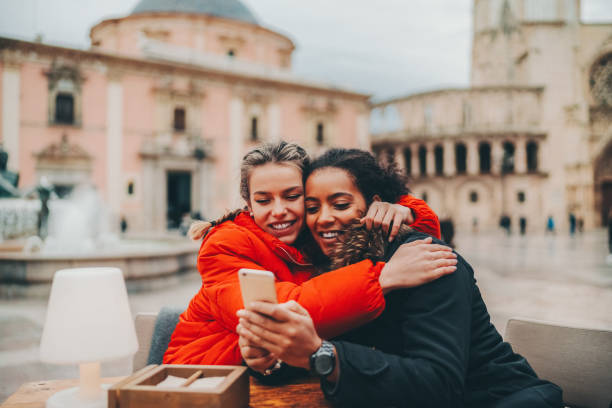 istock Friends visiting Valencia taking selfie at Plaza de la Virgen 1807376478