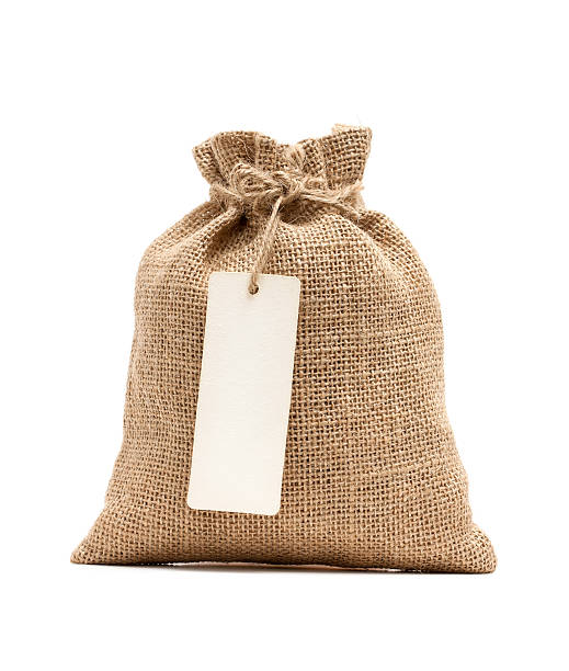 istock Burlap sack with blank label isolated on white background 180737676