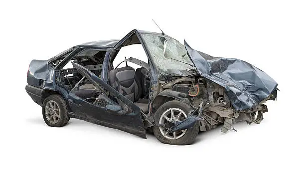 Damaged car after a terrible crash. Isolated on white background.