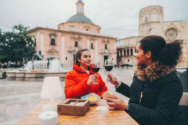 istock Friends drinking red wine in restaurant during travel 1807379195