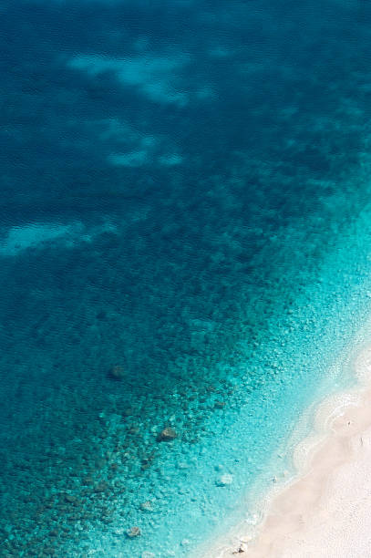 istock Bright Crystal Clear Waters Lap Mediterranean Beach 180737959