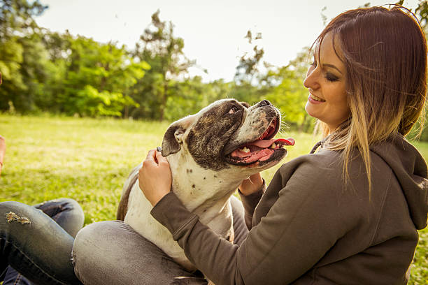 istock Young caucasian woman and her dog 180738352
