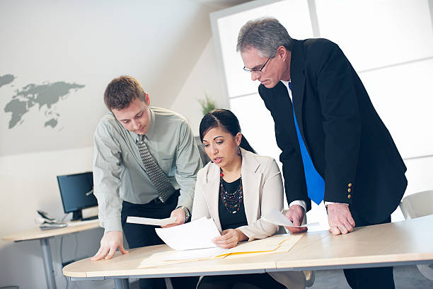 istock Business Team Meeting Going Over Papers 180738495