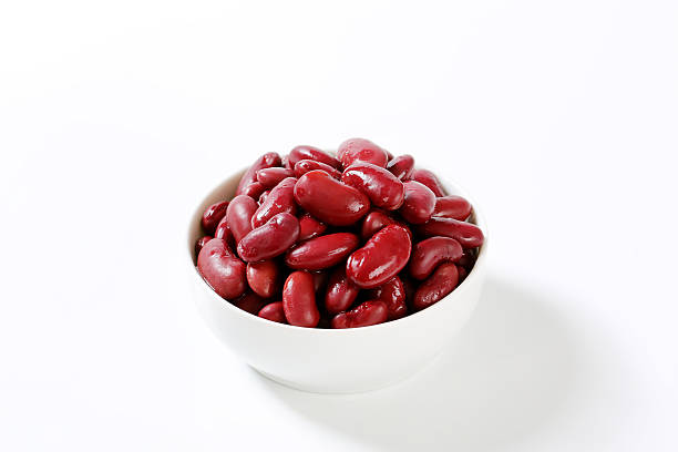 bowl of red beans bowl of cooked red beans on a white background kidney bean stock pictures, royalty-free photos & images