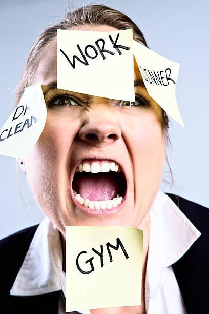 istock Enough! Too much multitasking enrages this young woman 180739059