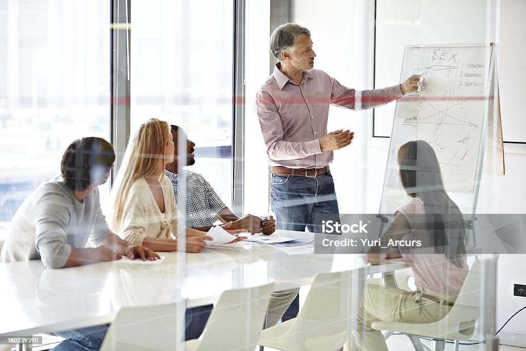Learning new ways to do business A group of businesspeople sitting in a seminar Adult Stock Photo