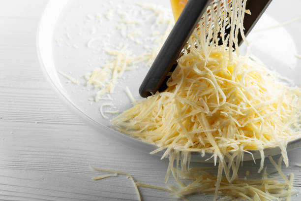 istock Grated cheese and grater. 1807395526