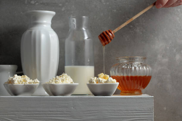 istock Fresh cottage cheese or ricotta with honey. 1807395873