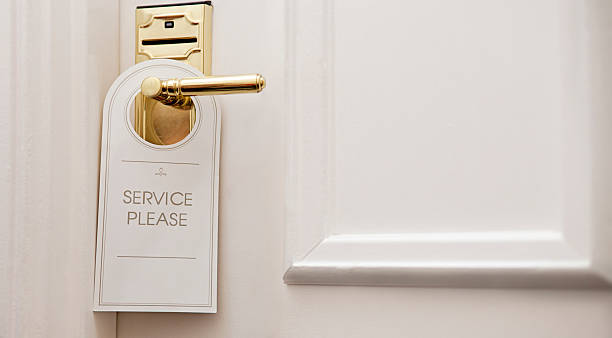istock Maid service hanger on hotel door knob 180739639