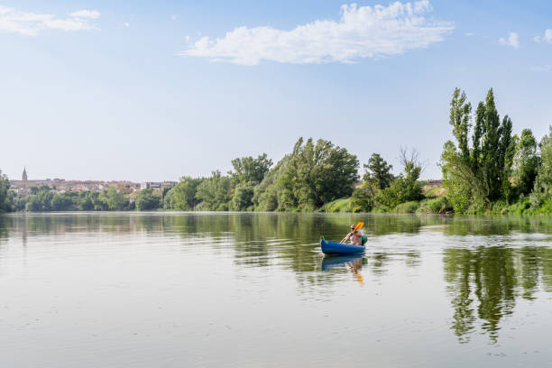 istock Man in a recreational canoe on the Douro River in summertime 1807400398