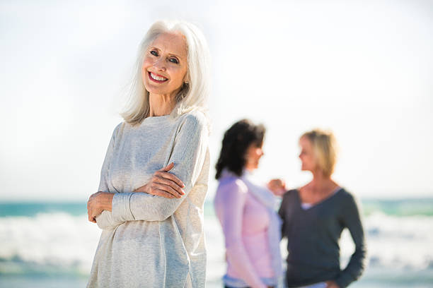 istock Beautiful senior woman on a beach. 180741207