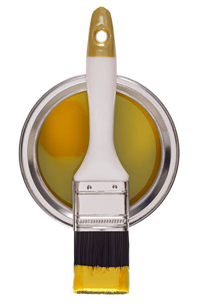 istock Paint brush on a tin of yellow paint 180741771