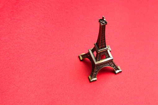 Eiffel Tower replica on red background