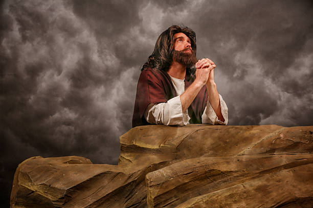 istock Jesus Christ kneeing and praying 180742013